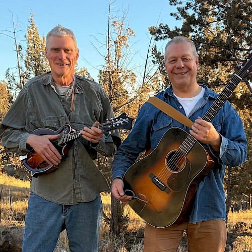 Americana folk musician Mavis Bretz performing acoustic guitar live at Currents Restaurant during Live Music Friday Riverhouse Lodge Bend Oregon.
