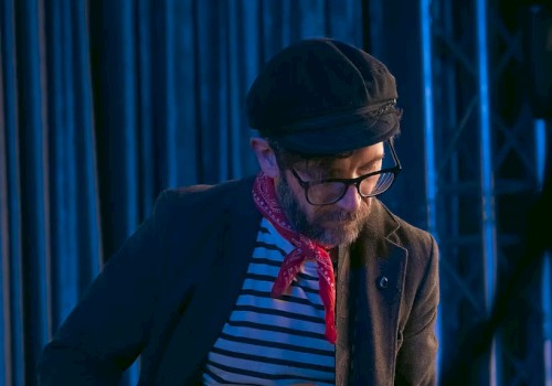 Singer-songwriter Chris Beland playing acoustic guitar during Live Music Fridays at Currents Restaurant in Riverhouse Lodge, Bend Oregon.