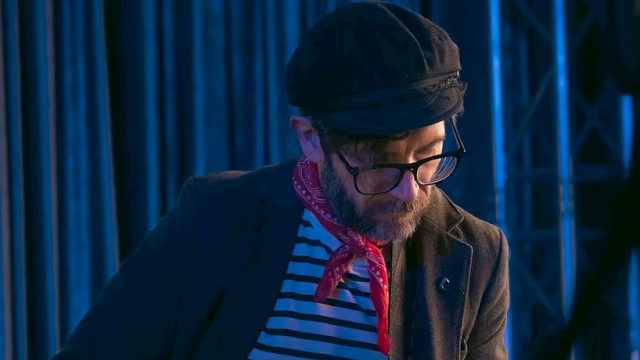 Singer-songwriter Chris Beland playing acoustic guitar during Live Music Fridays at Currents Restaurant in Riverhouse Lodge, Bend Oregon.