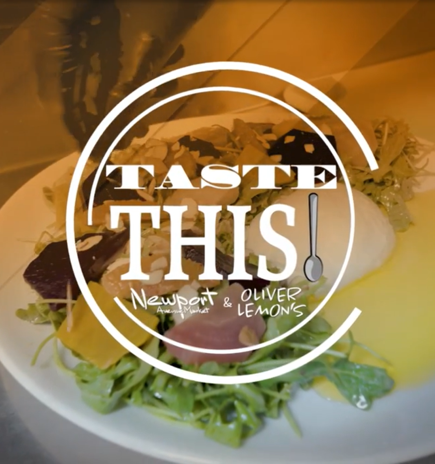 A fresh salad with various vegetables, topped with herbs, and a drizzle of dressing, served on a white plate.