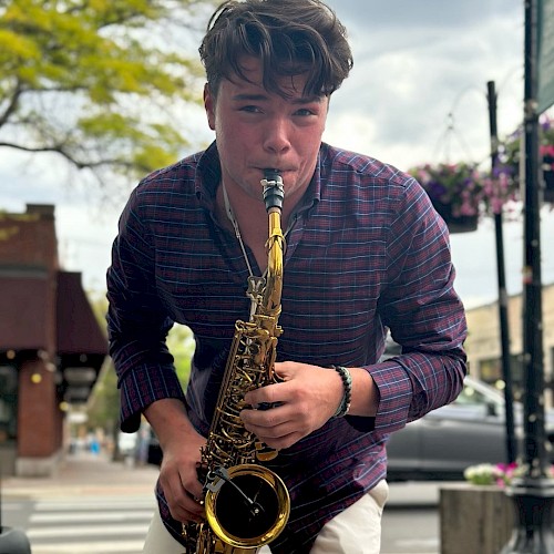 Carson Hackbart playing saxophone live during brunch at Currents Riverhouse Lodge Bend Oregon
