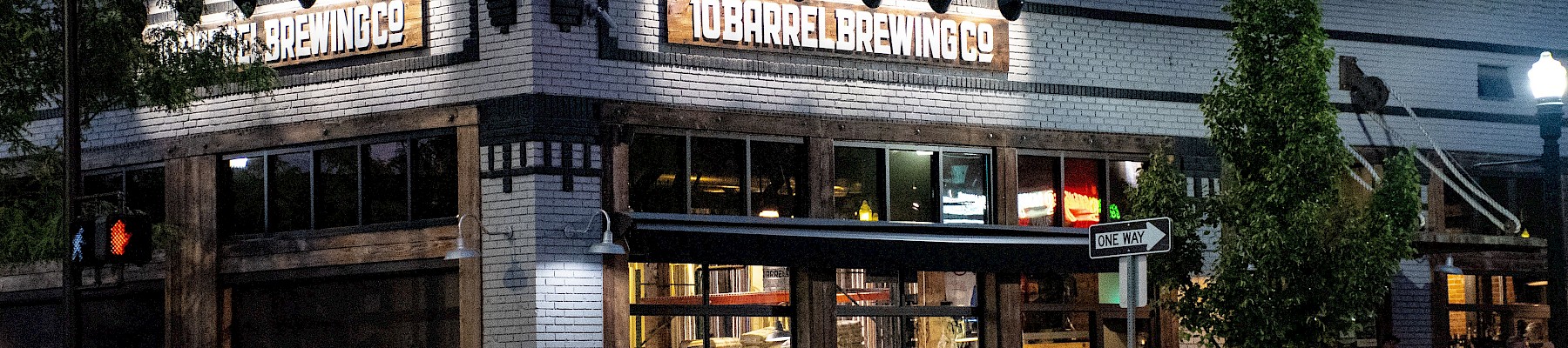 The image shows a busy brewery called 