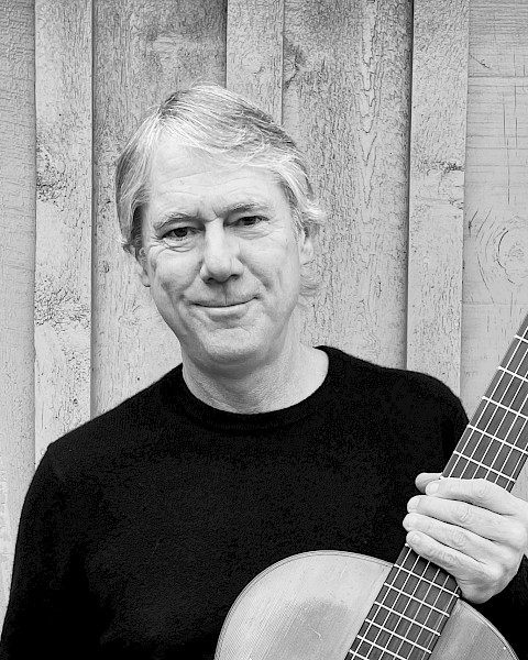 James Townsend performing acoustic folk music during Beats & Bites Brunch at Currents Restaurant Bend Oregon