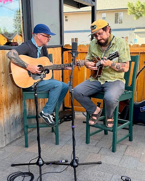 The Lava Butte Boys, a Central Oregon bluegrass duo featuring Maxx Lopez and Jordy Webb, performing traditional bluegrass music with guitar and harmony vocals.