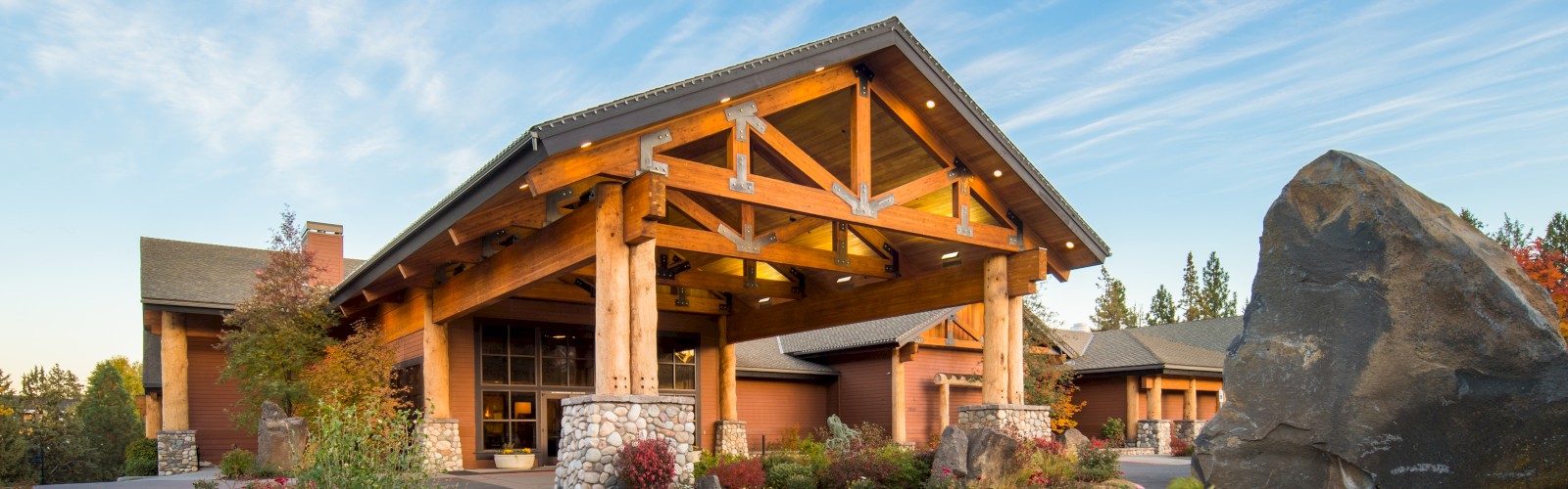 Riverhouse Convention Center entrance to a building with a landscaped garden and blue sky in Bend, Oregon.