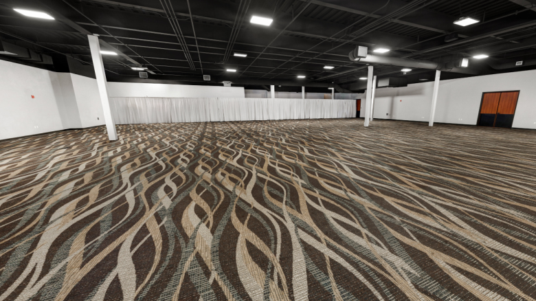 An empty conference room with patterned carpet, white walls, and pillars supporting a black ceiling. Double doors are visible on the right.