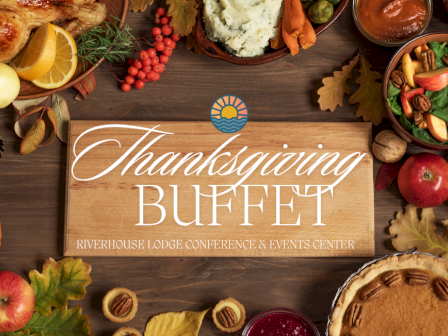 A Thanksgiving buffet sign with turkey, mashed potatoes, salad, pie, fruits, and fall decorations around it.