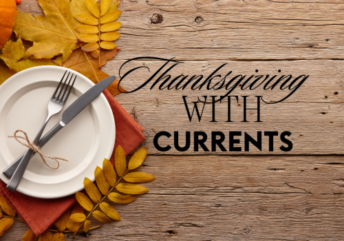 A wooden table with autumn leaves, a plate, and cutlery, alongside text: 