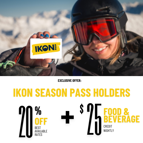 A person holds an IKON pass in snowy mountains. Offer: 20% off rates and $25 food/beverage credit for IKON season pass holders.