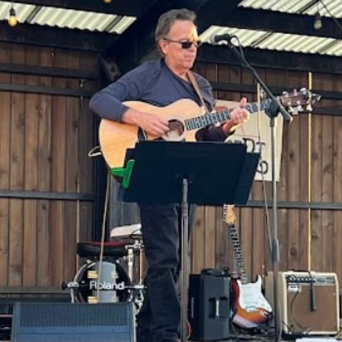 Keith Borman performing acoustic folk music for brunch 07/20/25 at Currents, Riverhouse Lodge in Bend, Oregon