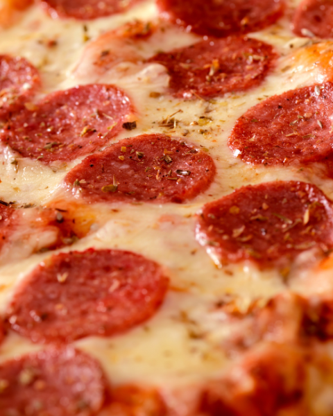 $10 flatbread pizza with pepperoni slices and melted cheese on a wooden board at Currents at Riverhouse in Bend Oregon July 28
