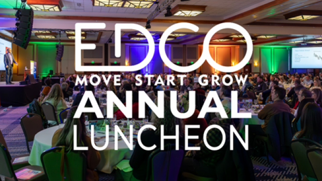 A full ballroom at Riverhouse Lodge set for the EDCO Annual Luncheon, with colorful stage lighting and a large audience—showcasing the lodge as a premier Central Oregon venue for conferences, large meetings, and corporate events.